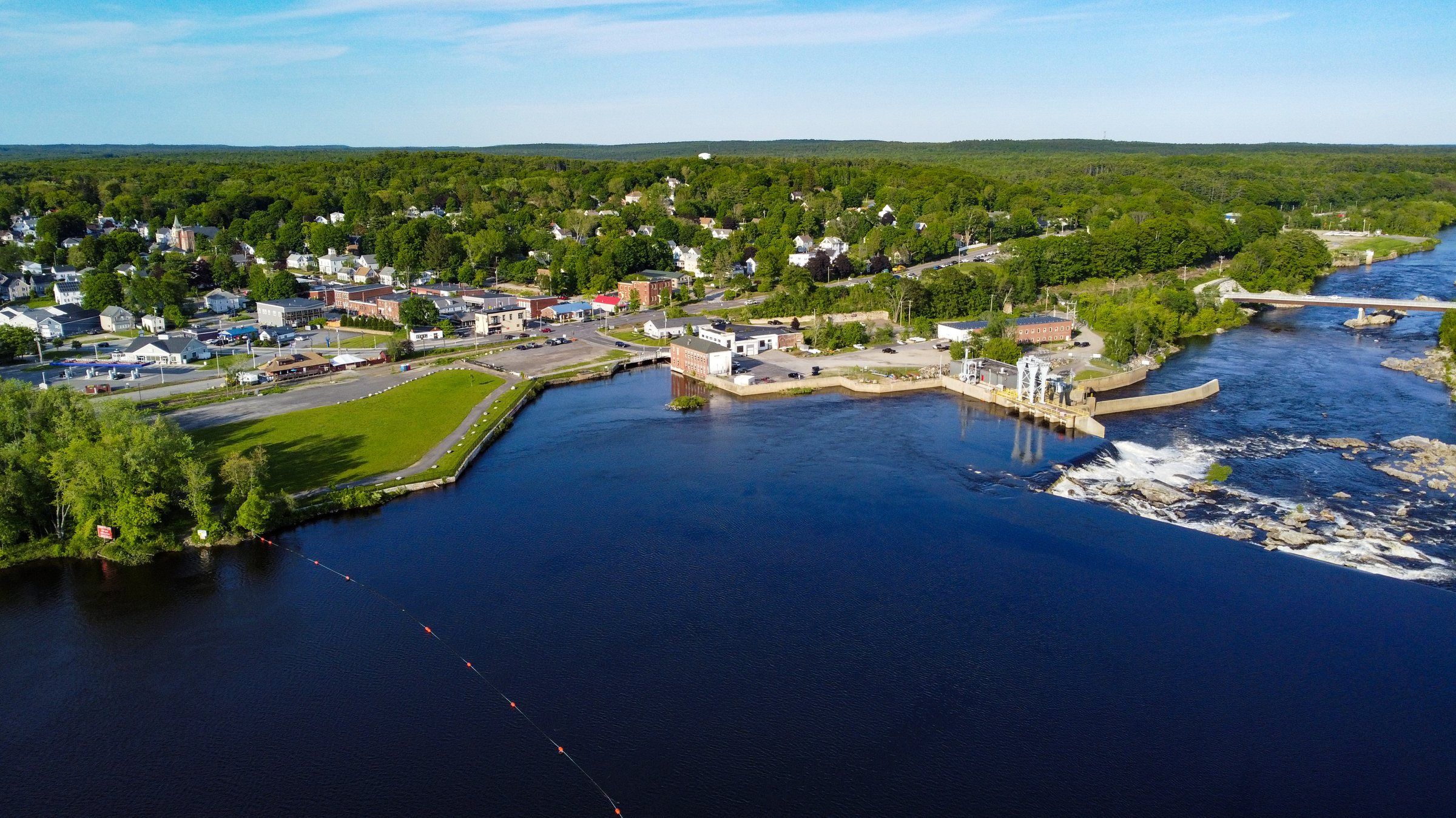 The Androscoggin River, the falls and the Worumbo lawn from above, with Lisbon Falls village beyond