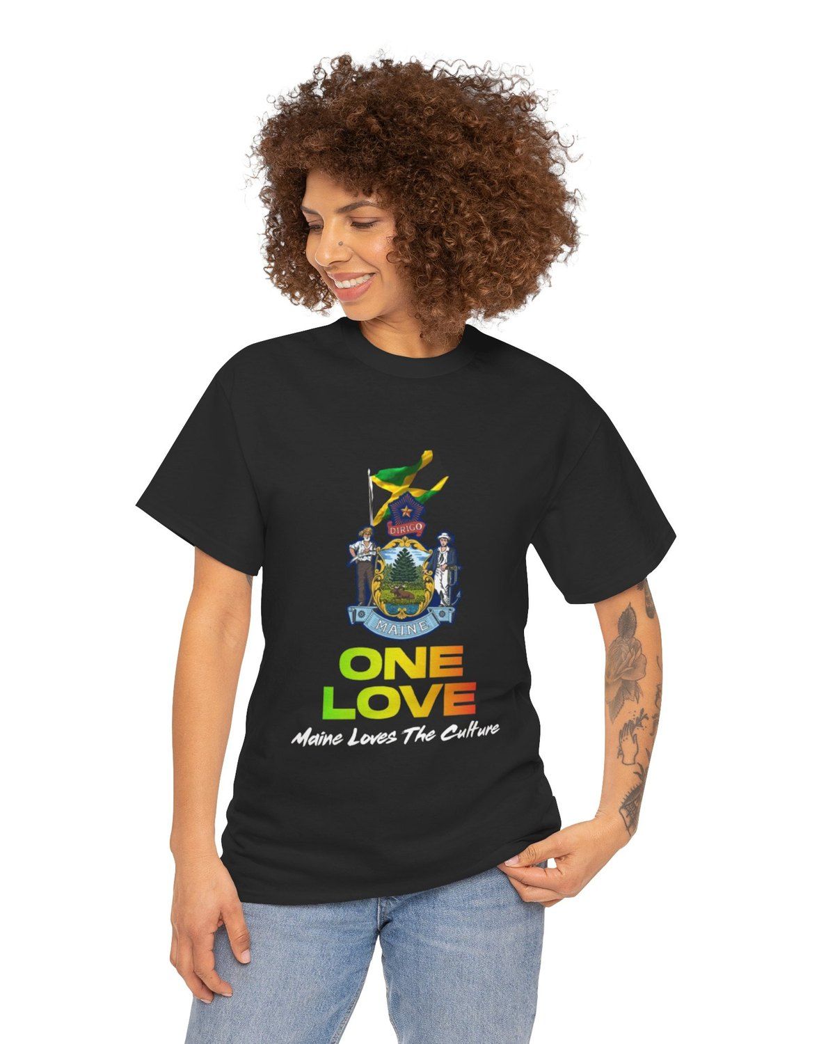A woman wearing the black One Love tee — the Maine state seal flying the Jamaican flag, with "One Love" and "Maine Loves The Culture" underneath