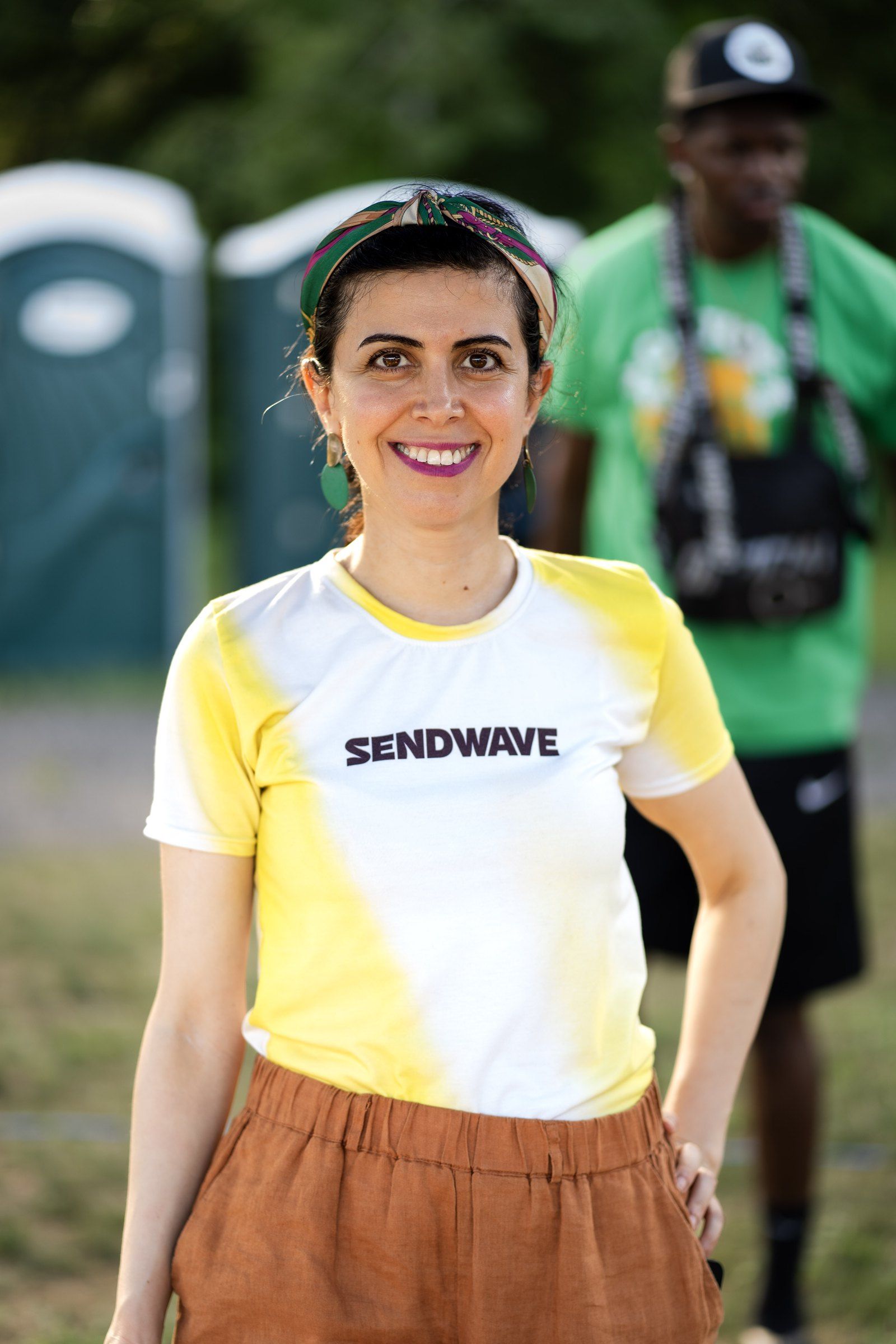 A Sendwave brand representative at the company’s activation table, 2024