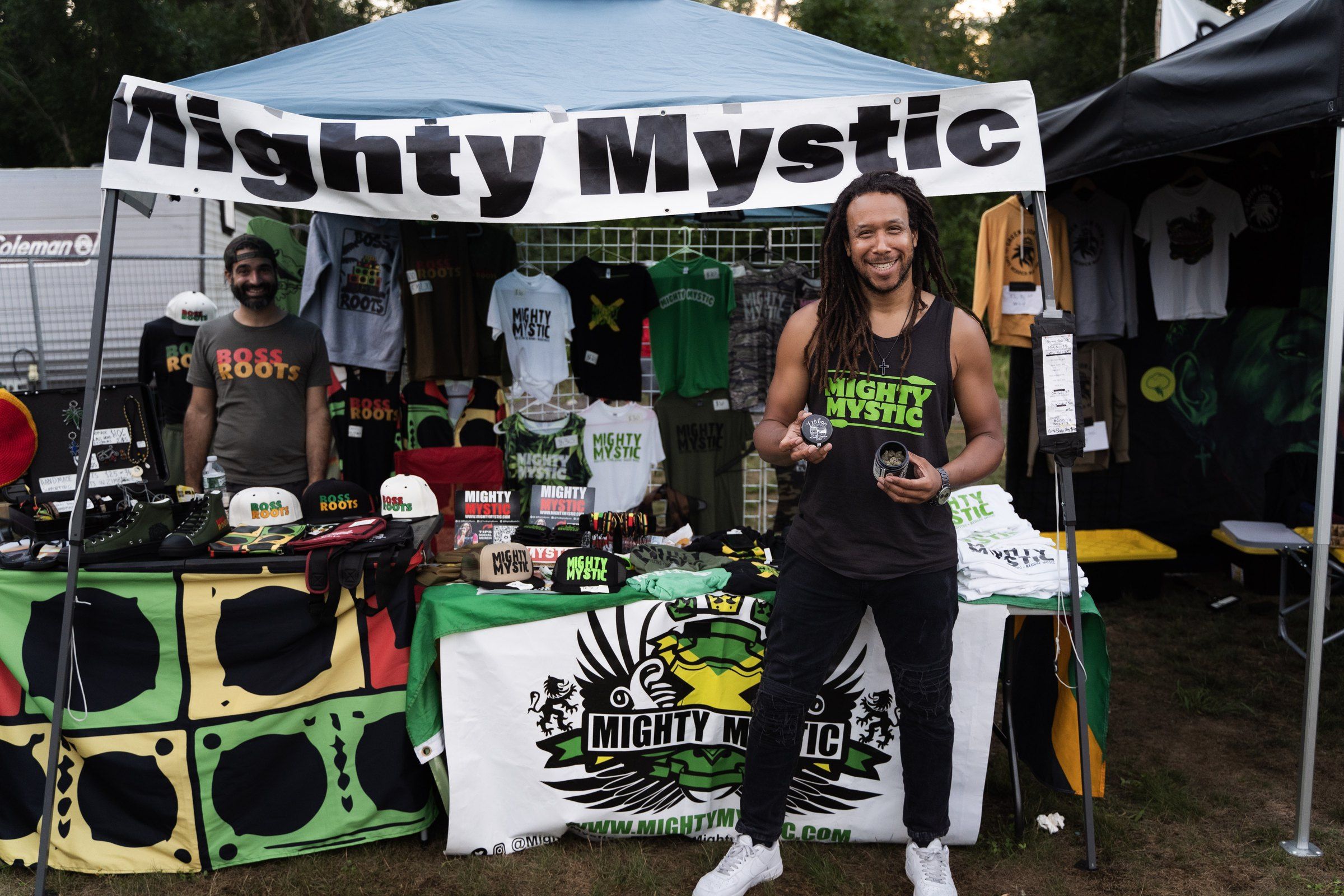 The Mighty Mystic merchandise booth in the vendor village, 2024